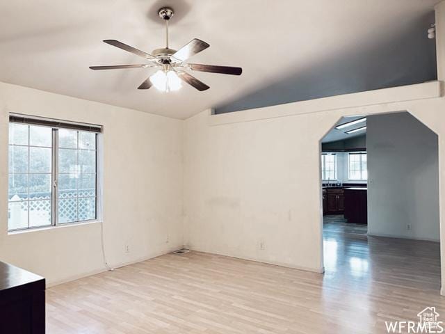 2103 S Mountain Vista Ln E, Provo, UT 84606 - unfurnished room with light wood-type flooring, lofted ceiling, arched walkways, and ceiling fan