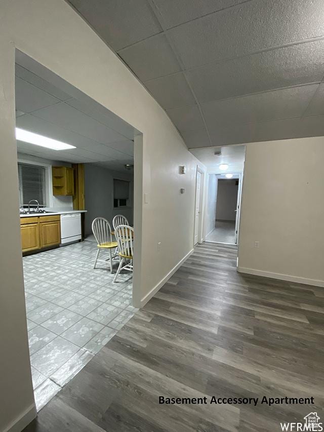 2103 S Mountain Vista Ln E, Provo, UT 84606 - corridor featuring a drop ceiling, a sink, baseboards, and wood finished floors