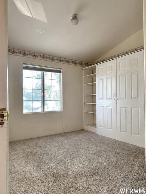 2103 S Mountain Vista Ln E, Provo, UT 84606 - unfurnished bedroom with carpet floors, lofted ceiling, and a closet