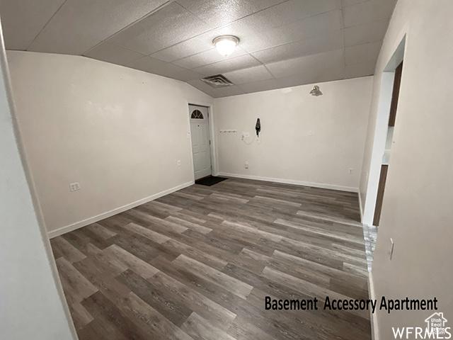 2103 S Mountain Vista Ln E, Provo, UT 84606 - spare room featuring baseboards, lofted ceiling, visible vents, and wood finished floors