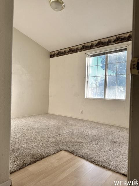 2103 S Mountain Vista Ln E, Provo, UT 84606 - spare room with lofted ceiling and wood finished floors