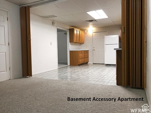 2103 S Mountain Vista Ln E, Provo, UT 84606 - unfurnished room featuring visible vents, baseboards, and a paneled ceiling