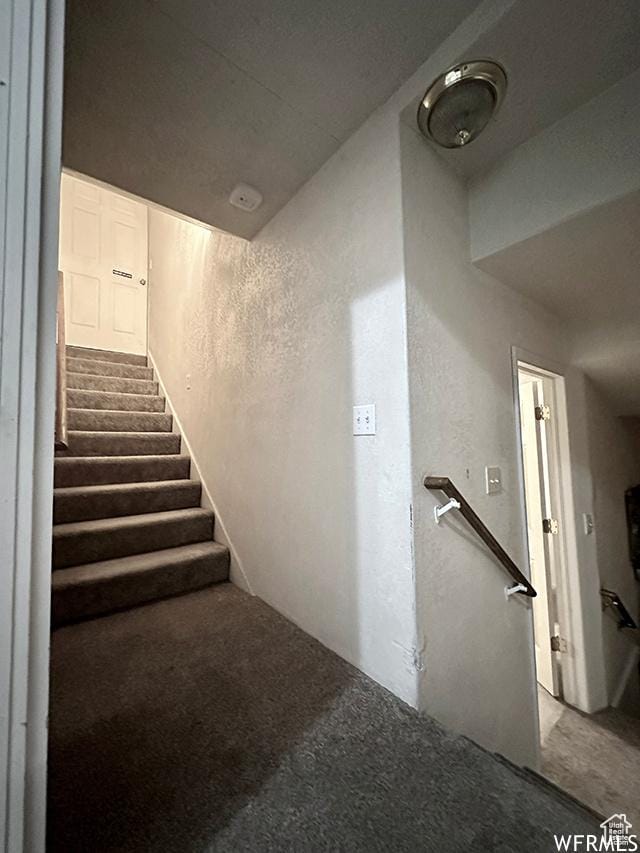 2103 S Mountain Vista Ln E, Provo, UT 84606 - stairway featuring a textured wall and carpet