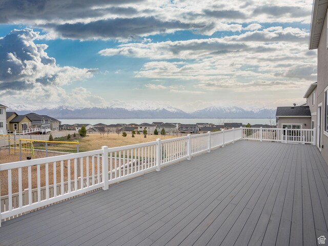 wooden terrace with a mountain view and a residential view