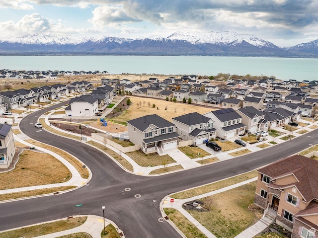 birds eye view of property featuring a residential view and a water and mountain view