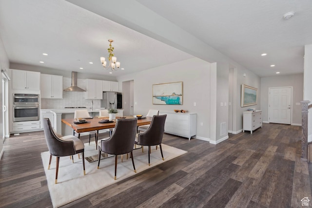 dining room featuring dark wood-type flooring, baseboards, visible vents, recessed lighting, and an inviting chandelier