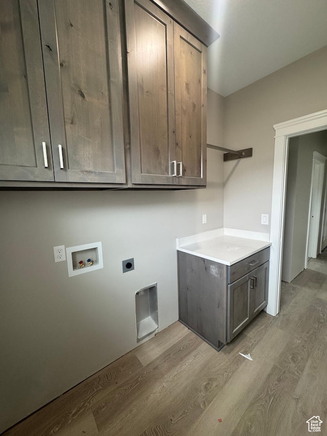 1870 N Valley View Dr Unit 201, Layton, UT 84040 - laundry room featuring hookup for an electric dryer, cabinet space, hookup for a washing machine, and light wood finished floors