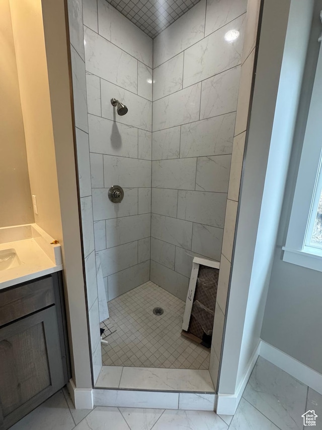 1870 N Valley View Dr Unit 201, Layton, UT 84040 - full bathroom featuring marble look tile flooring, tiled shower, and vanity
