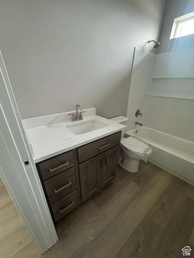 1870 N Valley View Dr Unit 201, Layton, UT 84040 - bathroom with wood finished floors, vanity, and washtub / shower combination