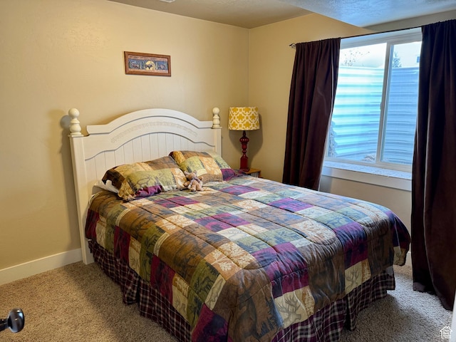 29 W Tamarind Way, Garden City, UT 84028 - carpeted bedroom featuring baseboards and multiple windows