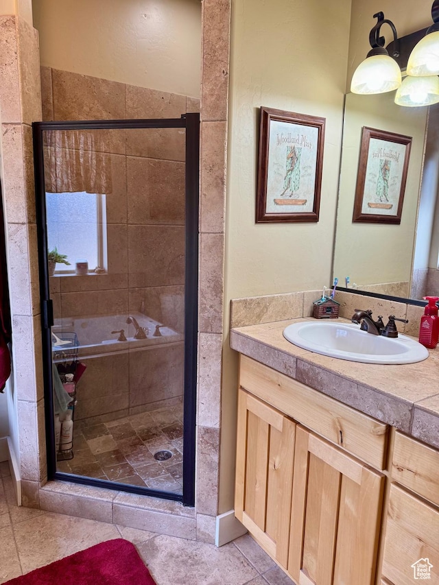 29 W Tamarind Way, Garden City, UT 84028 - bathroom featuring tile patterned floors, a shower stall, and vanity