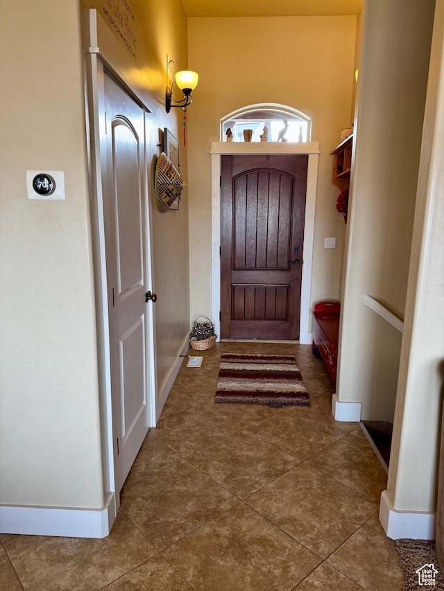 29 W Tamarind Way, Garden City, UT 84028 - doorway with baseboards and tile patterned flooring