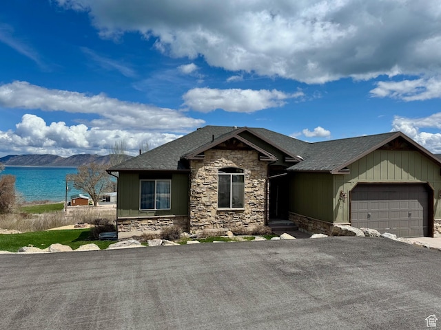 29 W Tamarind Way, Garden City, UT 84028 - single story home with fence, a shingled roof, an attached garage, aphalt driveway, and stone siding