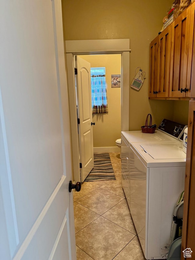 29 W Tamarind Way, Garden City, UT 84028 - laundry area featuring cabinet space, washing machine and dryer, and light tile patterned flooring