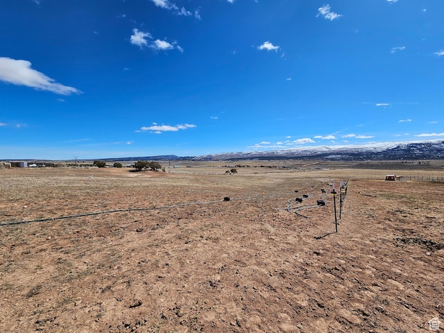 property view of water with a mountain view and a rural view