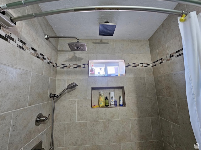 full bath with a tile shower
