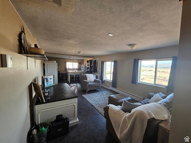 carpeted living room with baseboards, a baseboard heating unit, and a textured ceiling