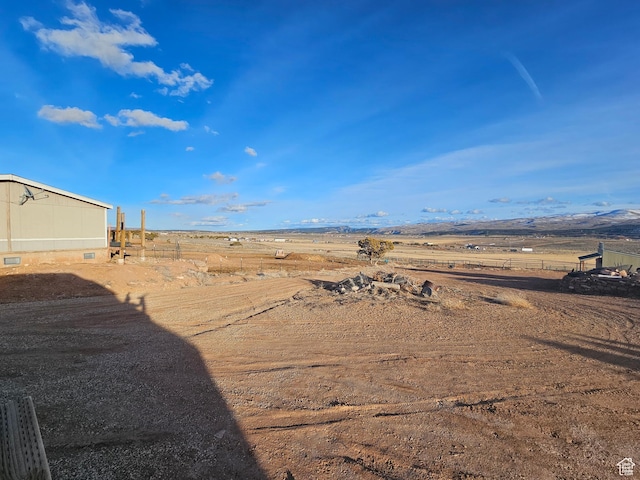 view of yard with a rural view