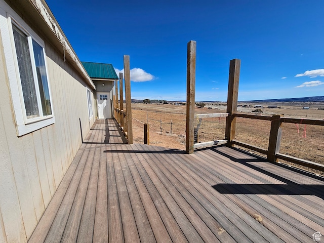 wooden deck featuring a rural view