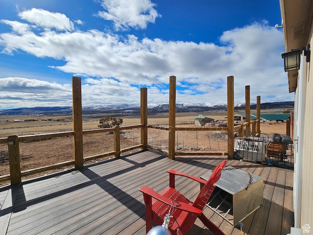 wooden deck featuring a mountain view