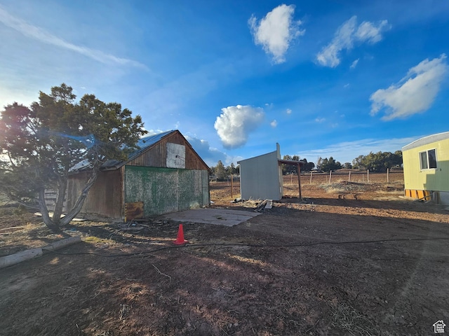 exterior space with fence and an outdoor structure