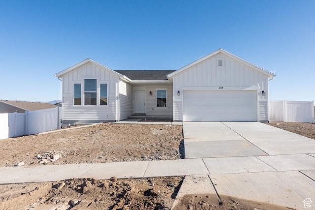 1167 W Rocky Way Unit 617, Grantsville, UT 84029 - ranch-style home with board and batten siding, driveway, fence, and an attached garage