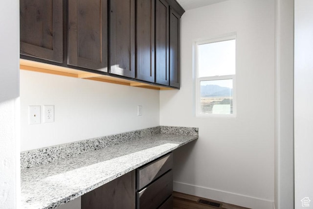 1167 W Rocky Way Unit 617, Grantsville, UT 84029 - unfurnished office featuring dark wood finished floors, baseboards, and visible vents