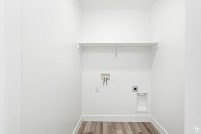 1167 W Rocky Way Unit 617, Grantsville, UT 84029 - clothes washing area featuring wood finished floors, hookup for an electric dryer, laundry area, baseboards, and hookup for a washing machine