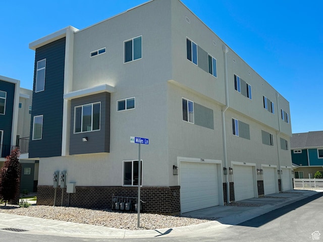 2372 W Leigh Ln Unit G25-28, West Haven, UT 84401 - view of building exterior with an attached garage