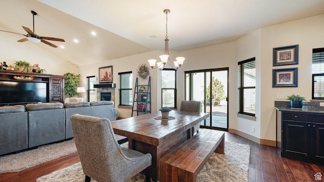 198 E Cameron Dr, Saratoga Springs, UT 84045 - dining area with ceiling fan with notable chandelier, lofted ceiling, baseboards, and dark wood-style flooring