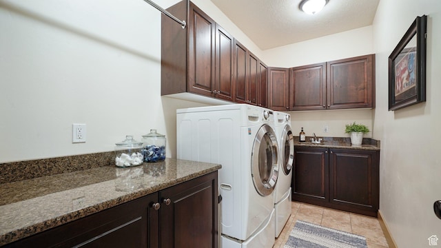 198 E Cameron Dr, Saratoga Springs, UT 84045 - laundry room featuring light tile patterned flooring, washer and clothes dryer, cabinet space, and a textured ceiling
