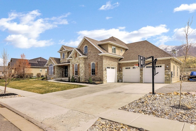 116 N 820 E, Hyde Park, UT 84318 - view of front facade with concrete driveway, roof with shingles, stone siding, a front yard, and a garage