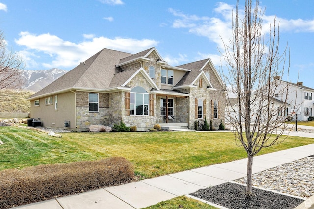 116 N 820 E, Hyde Park, UT 84318 - craftsman inspired home featuring a front lawn, a shingled roof, stone siding, and central AC