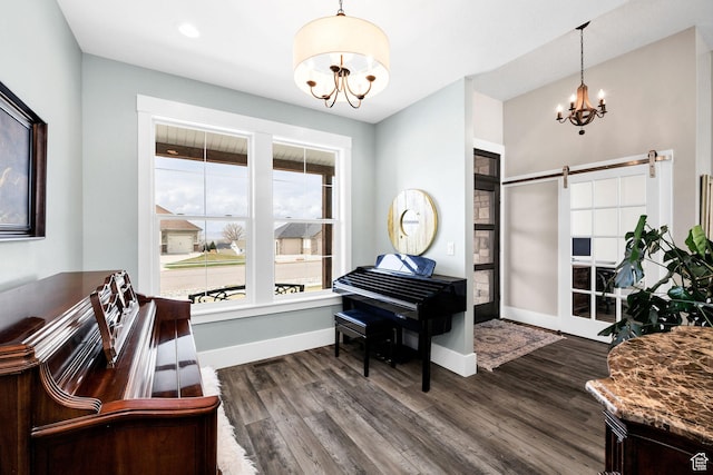 116 N 820 E, Hyde Park, UT 84318 - living area featuring baseboards, a barn door, dark wood-type flooring, and an inviting chandelier