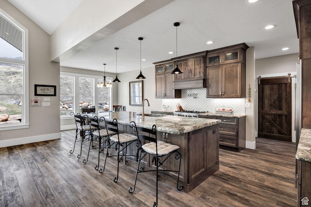 116 N 820 E, Hyde Park, UT 84318 - kitchen with a sink, dark brown cabinets, dark wood-type flooring, and tasteful backsplash