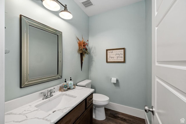 116 N 820 E, Hyde Park, UT 84318 - bathroom with toilet, vanity, wood finished floors, baseboards, and visible vents