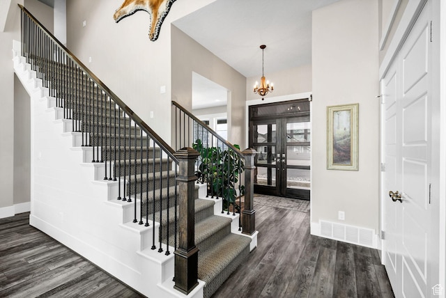 116 N 820 E, Hyde Park, UT 84318 - entrance foyer with visible vents, baseboards, wood finished floors, stairway, and an inviting chandelier