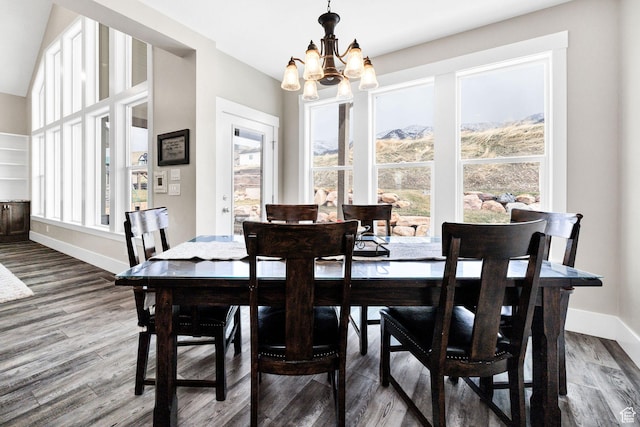 116 N 820 E, Hyde Park, UT 84318 - dining space featuring a healthy amount of sunlight, an inviting chandelier, and dark wood finished floors