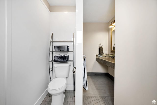 116 N 820 E, Hyde Park, UT 84318 - bathroom featuring baseboards and toilet