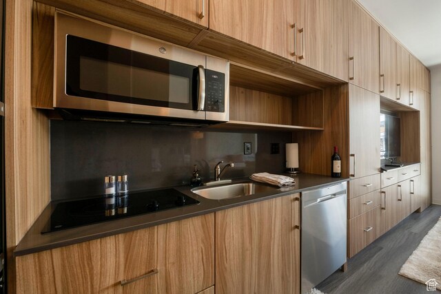 2670 W Canyons Resort Dr Unit 432, Park City, UT 84098 - kitchen with tasteful backsplash, a sink, dark countertops, modern cabinets, and appliances with stainless steel finishes