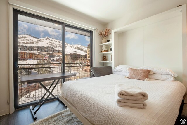 2670 W Canyons Resort Dr Unit 432, Park City, UT 84098 - bedroom with wood finished floors, a mountain view, and access to outside