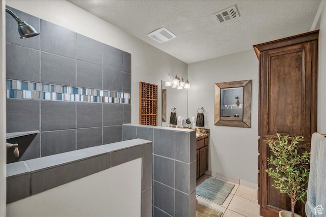 580 S 920 W, Hurricane, UT 84737 - bathroom featuring walk in shower, visible vents, vanity, and a textured ceiling