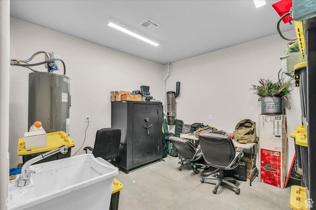 580 S 920 W, Hurricane, UT 84737 - home office featuring concrete flooring, a sink, electric water heater, and visible vents