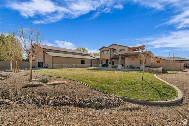 580 S 920 W, Hurricane, UT 84737 - rear view of house with a yard, stucco siding, fence, and a patio area