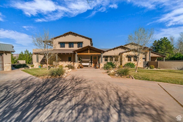 580 S 920 W, Hurricane, UT 84737 - mediterranean / spanish-style home with a front lawn, a tile roof, stucco siding, and stone siding