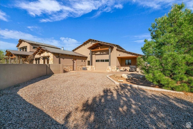 580 S 920 W, Hurricane, UT 84737 - exterior space featuring fence, stucco siding, a garage, and stone siding