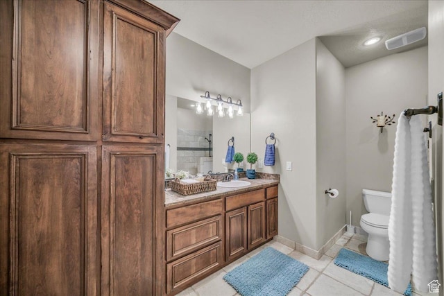 580 S 920 W, Hurricane, UT 84737 - bathroom with visible vents, baseboards, toilet, tiled shower, and tile patterned flooring