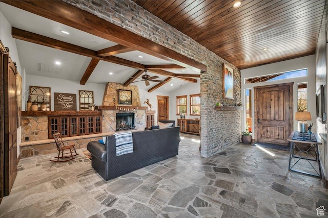 580 S 920 W, Hurricane, UT 84737 - living room featuring wooden ceiling, lofted ceiling with beams, stone floors, ceiling fan, and a fireplace