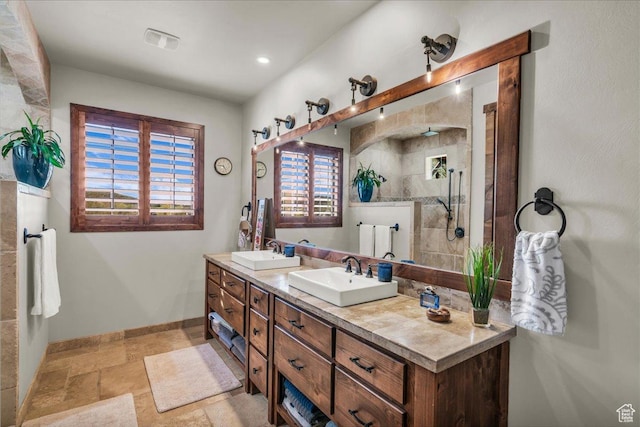 580 S 920 W, Hurricane, UT 84737 - full bath featuring baseboards, double vanity, a sink, and stone tile floors