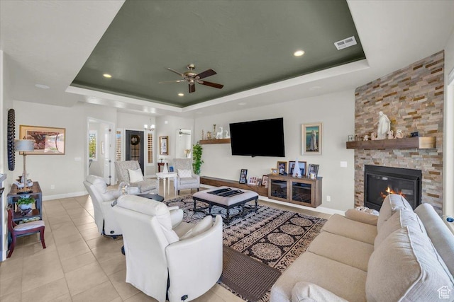875 E Roadrunner Dr, Washington, UT 84780 - living area with a raised ceiling, light tile patterned floors, baseboards, visible vents, and ceiling fan